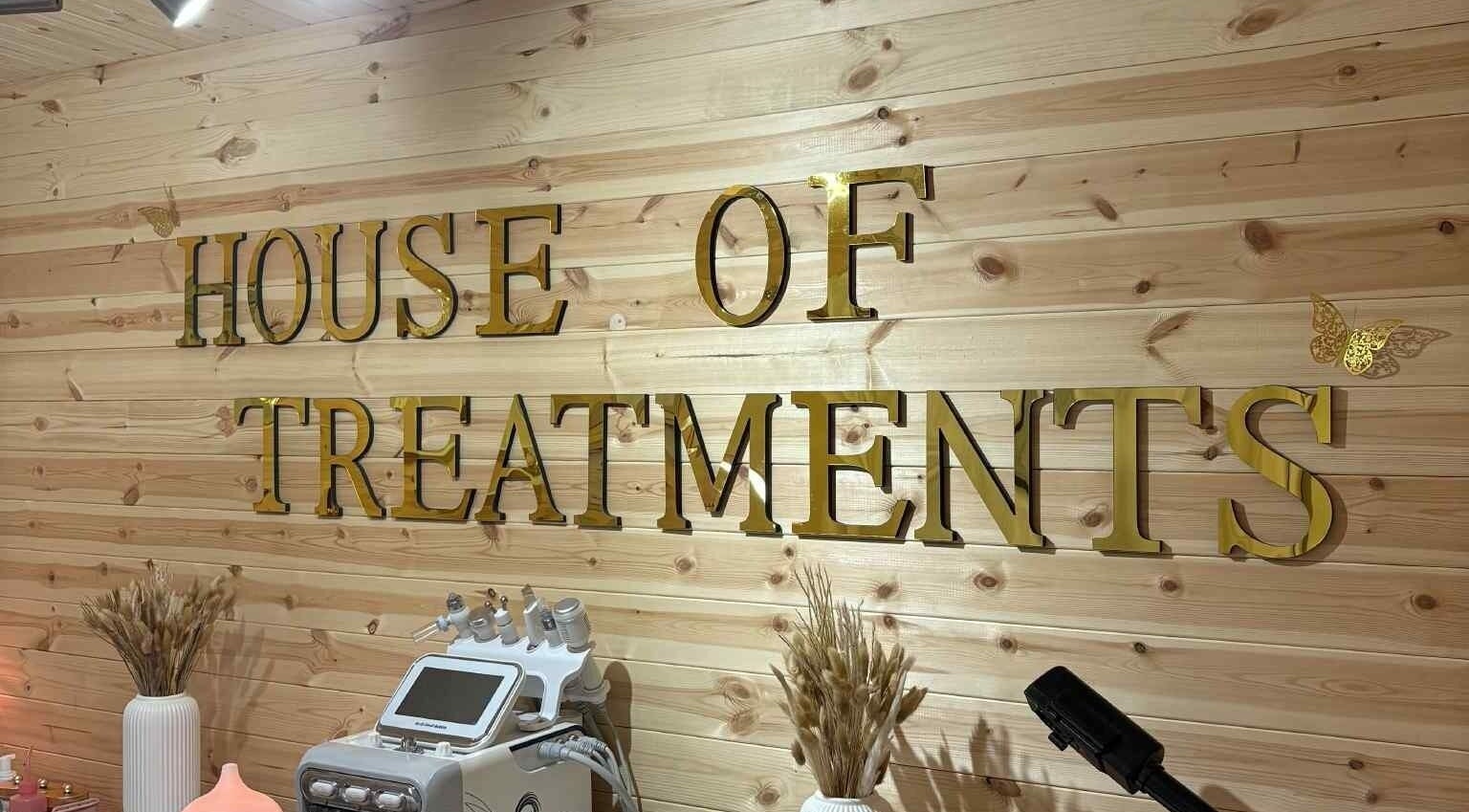 House Of Treatments interior with golden sign and equipment in Poole, England, GB.