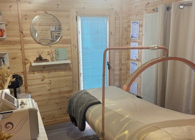 Cozy treatment room at House Of Treatments, Poole, England, GB with modern equipment and serene decor.
