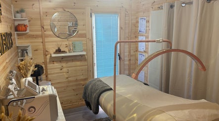 Cozy treatment room at House Of Treatments, Poole, England, GB with modern equipment and serene decor.