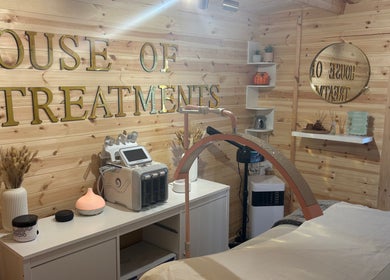 Cozy treatment room at House Of Treatments, Poole, England, GB, featuring modern equipment and soothing decor.