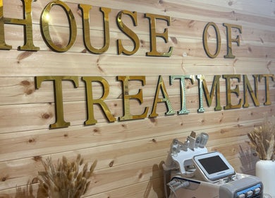 Wall sign and equipment at House Of Treatments, Poole, England, GB, showcasing serene beauty environment.