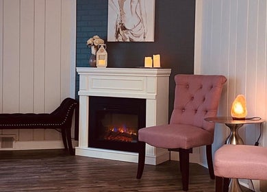Elegant seating area with fireplace at Beauty Lounge of Hanover, Hanover, Pennsylvania, US.
