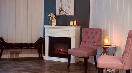 Elegant seating area with fireplace at Beauty Lounge of Hanover, Hanover, Pennsylvania, US.