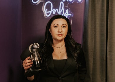 Beauty specialist at Beauty Lounge of Hanover, Pennsylvania, US, holding a skincare device.