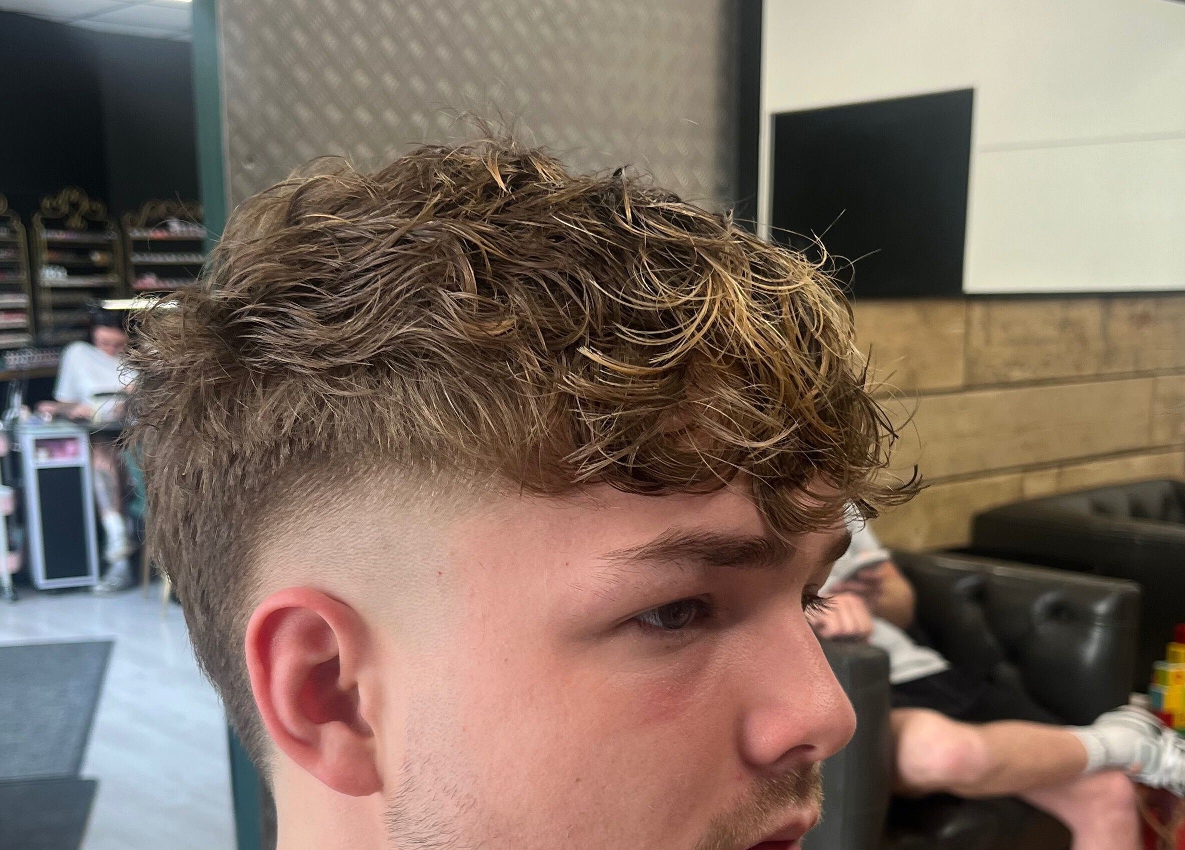 Fresh haircut at Harrison’s, Rotherham, England, GB, showcasing modern styling techniques.