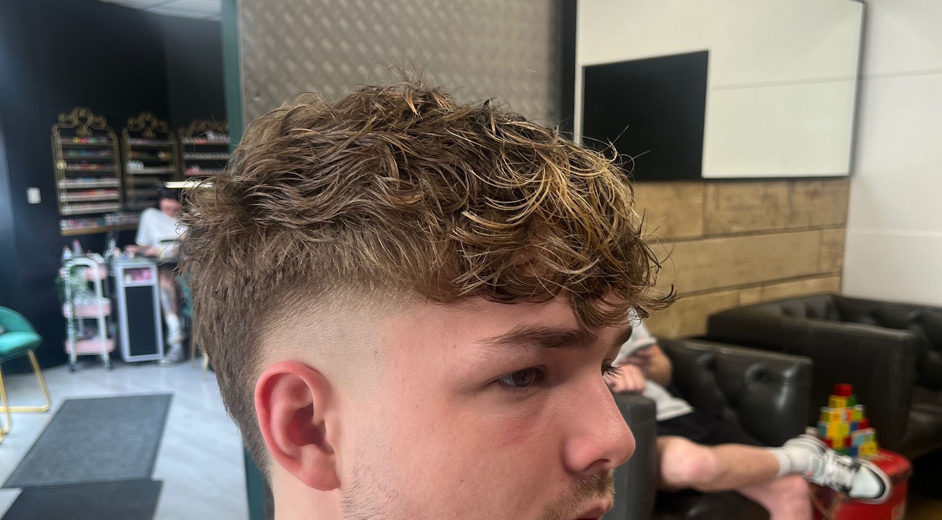 Fresh haircut at Harrison’s, Rotherham, England, GB, showcasing modern styling techniques.