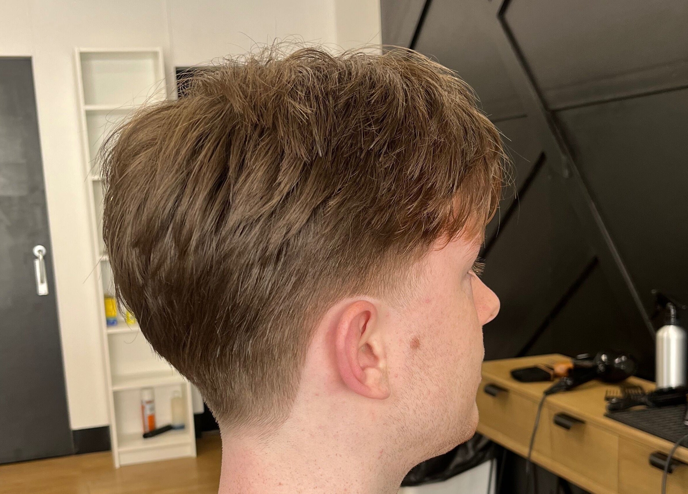Side view of a stylish haircut at Harrison’s, Rotherham, England, GB, showcasing expert grooming.