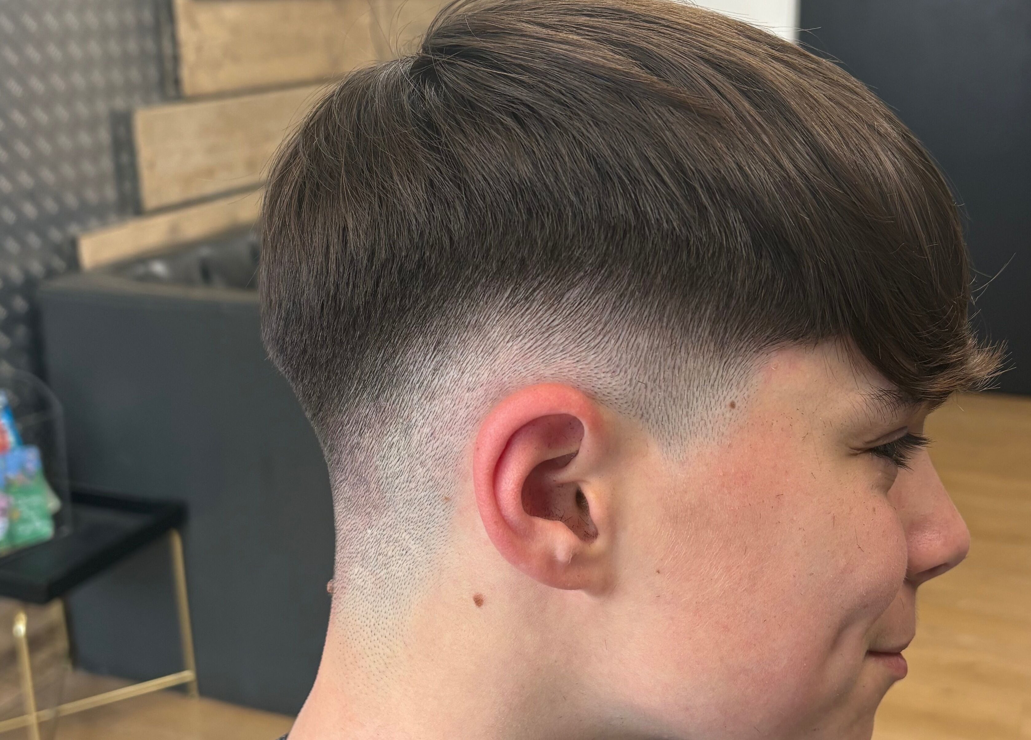 Stylish fade haircut at Harrison’s, Rotherham, England, GB, showcasing professional grooming.