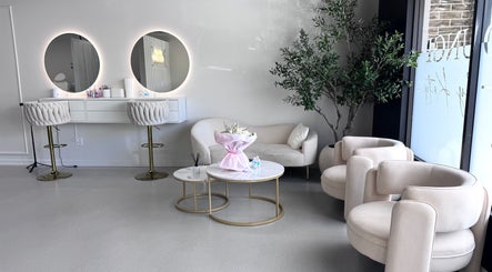 Elegant seating area at Brilliant Nails Lounge in Schaumburg, Illinois, US featuring modern decor and stylish chairs.