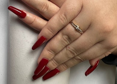 Stylish red nails manicure at Nifty Lash and Beauty, Hamilton, Waikato, NZ showcasing elegant nail design.