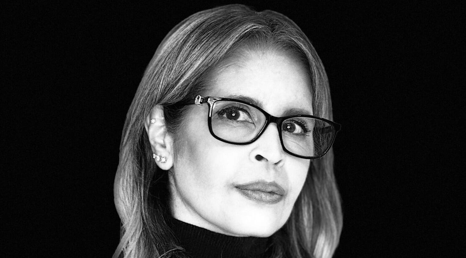 Elegant woman with glasses at Diana's Hair Rhythm Studio, Coral Gables, Florida, US.