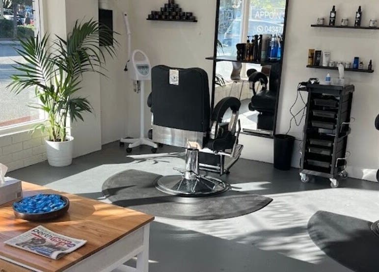 Chic interior of Enzo Stylez salon in Cottesloe, Western Australia, AU, featuring modern barber chairs and decor.