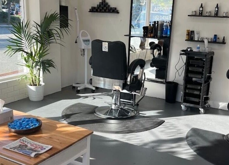 Chic interior of Enzo Stylez salon in Cottesloe, Western Australia, AU, featuring modern barber chairs and decor.