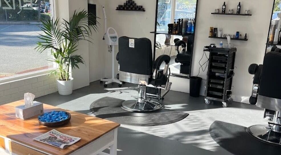 Chic interior of Enzo Stylez salon in Cottesloe, Western Australia, AU, featuring modern barber chairs and decor.