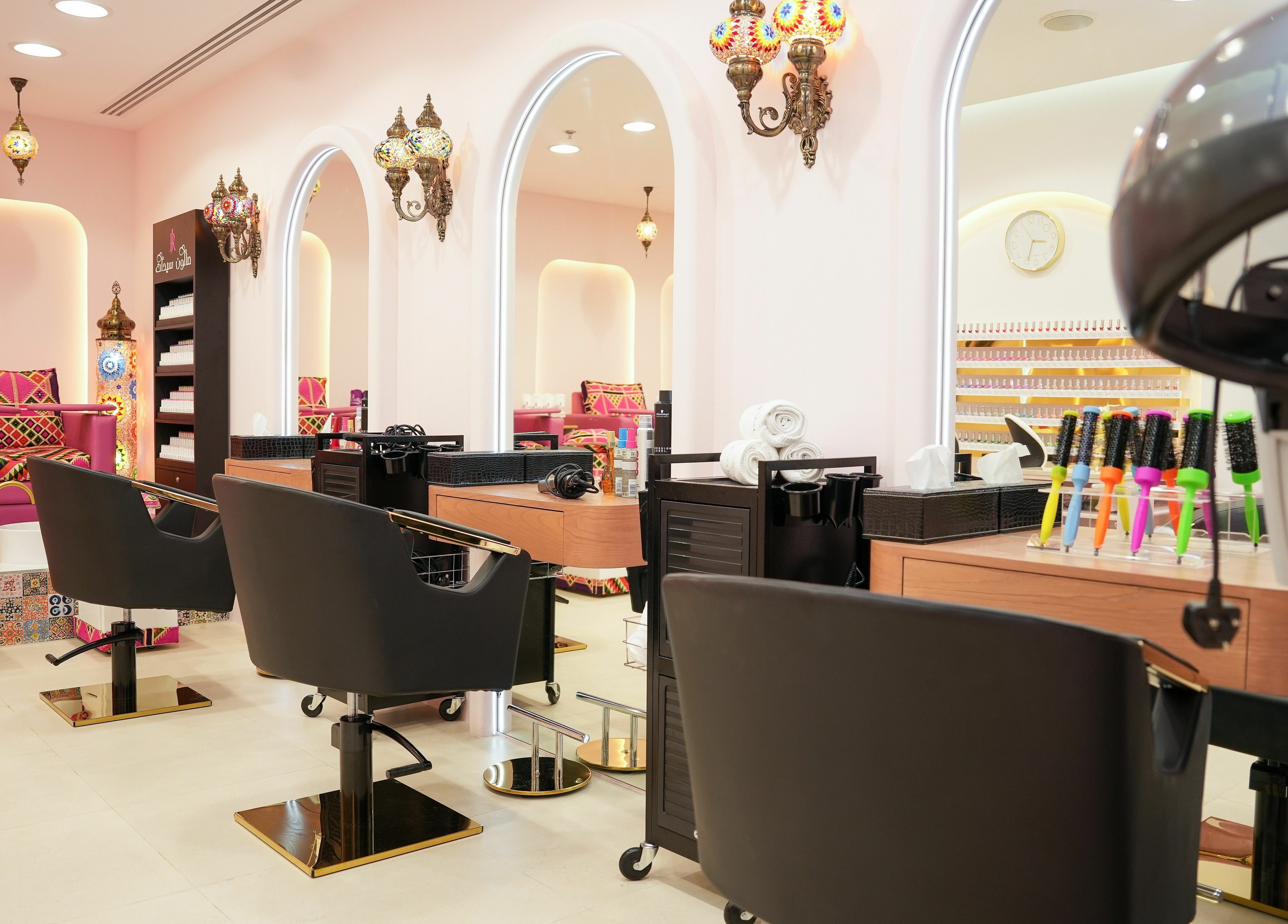 Interior of R N J Ladies Salon in Dubai, Dubai, AE, featuring stylish chairs and modern beauty equipment.