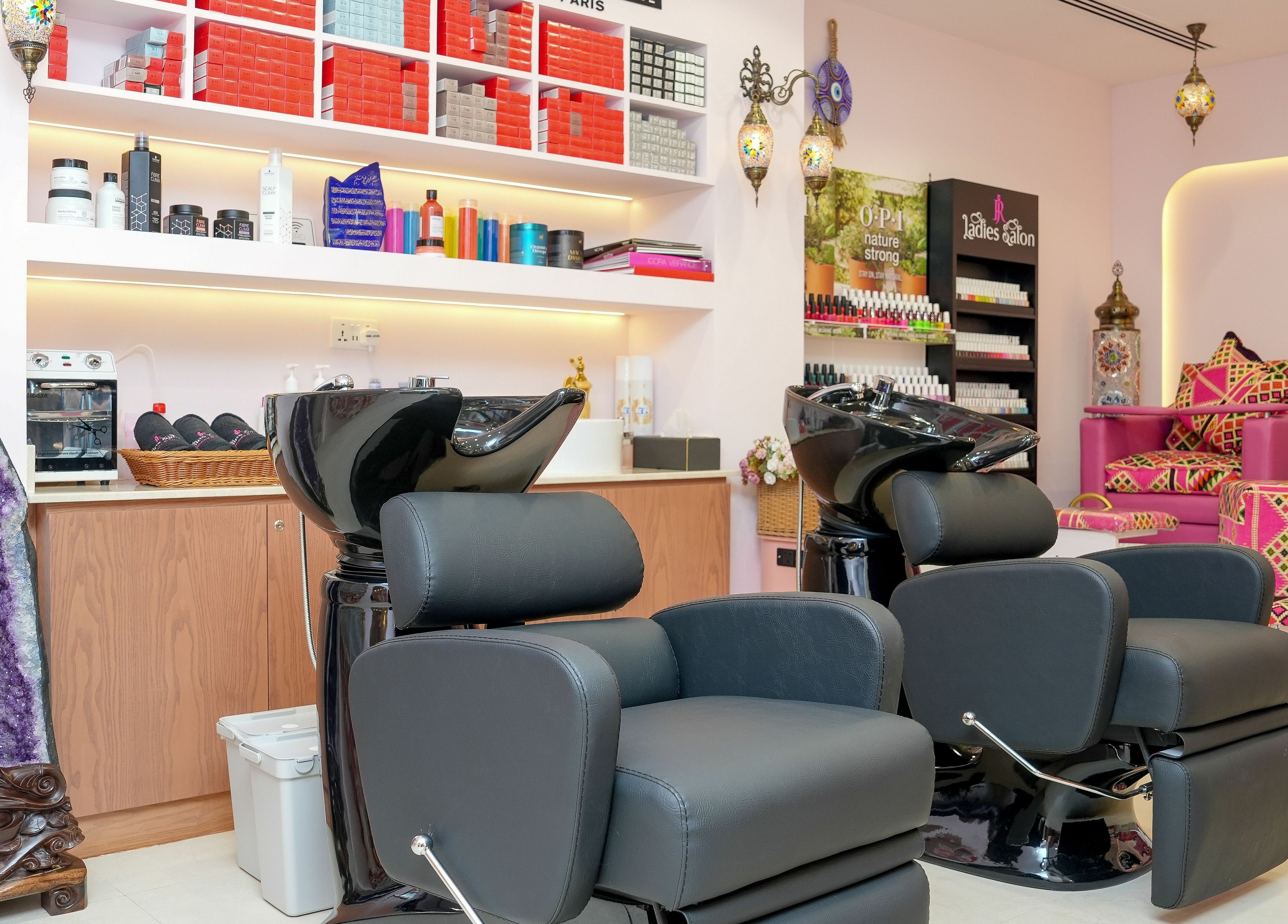 Luxurious salon setup at R N J Ladies Salon, Dubai, Dubai, AE with stylish chairs and colorful decor.