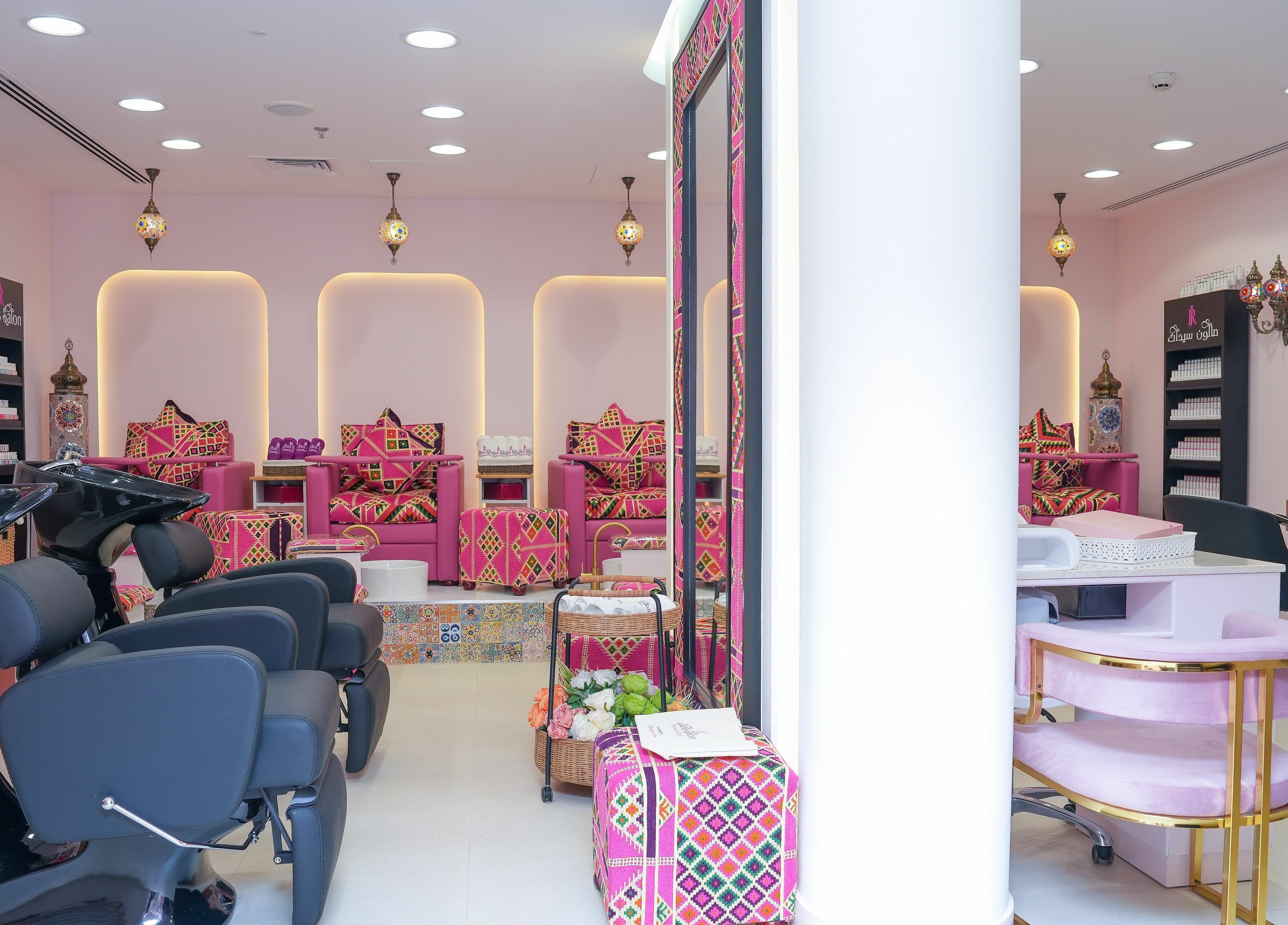 Interior view of R N J Ladies Salon in Dubai, Dubai, AE showcasing vibrant seating and modern styling stations.