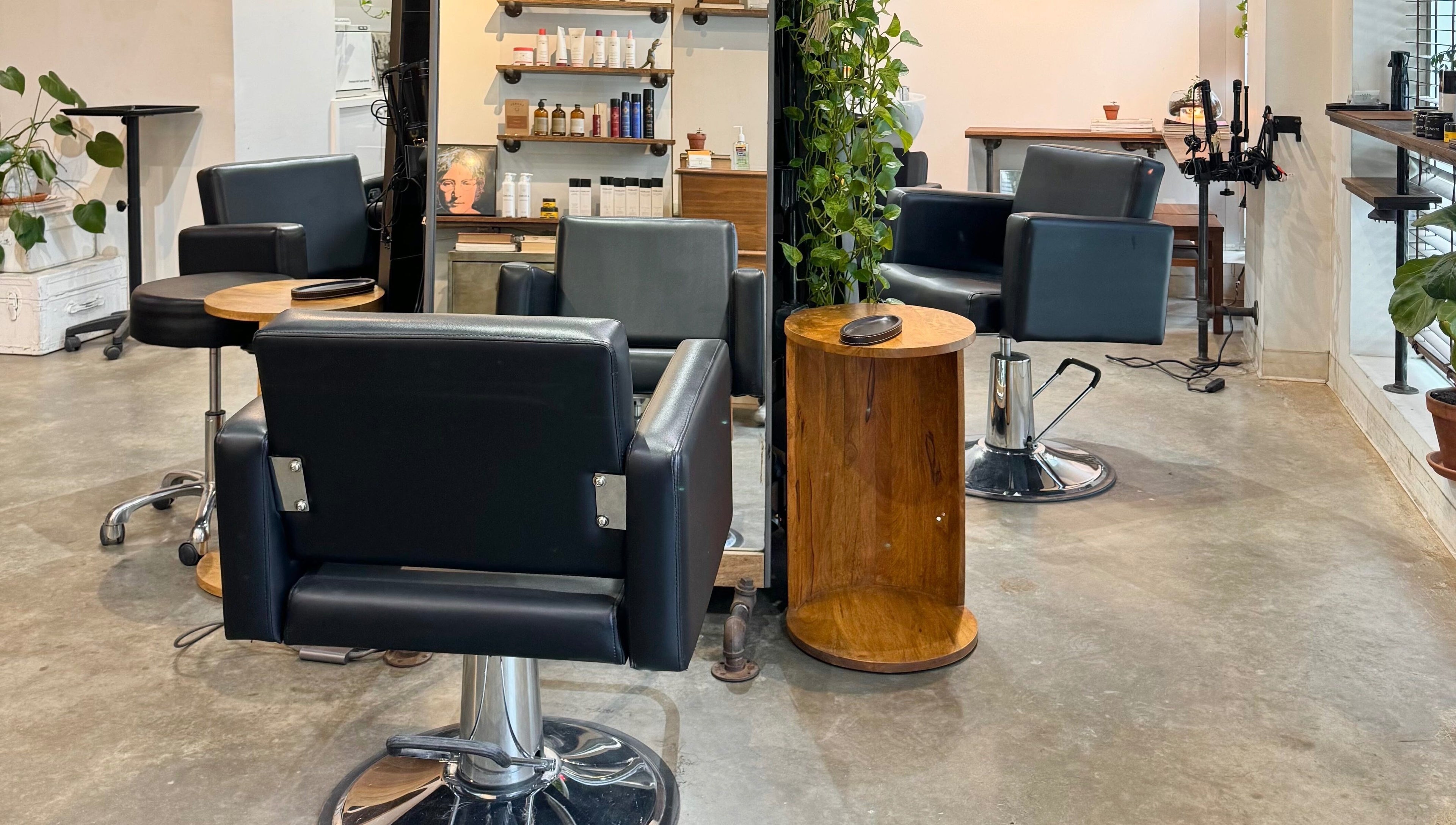 Elegant salon chairs and products at Laurel Bowery, New York, New York, US, offering beauty and wellness services.