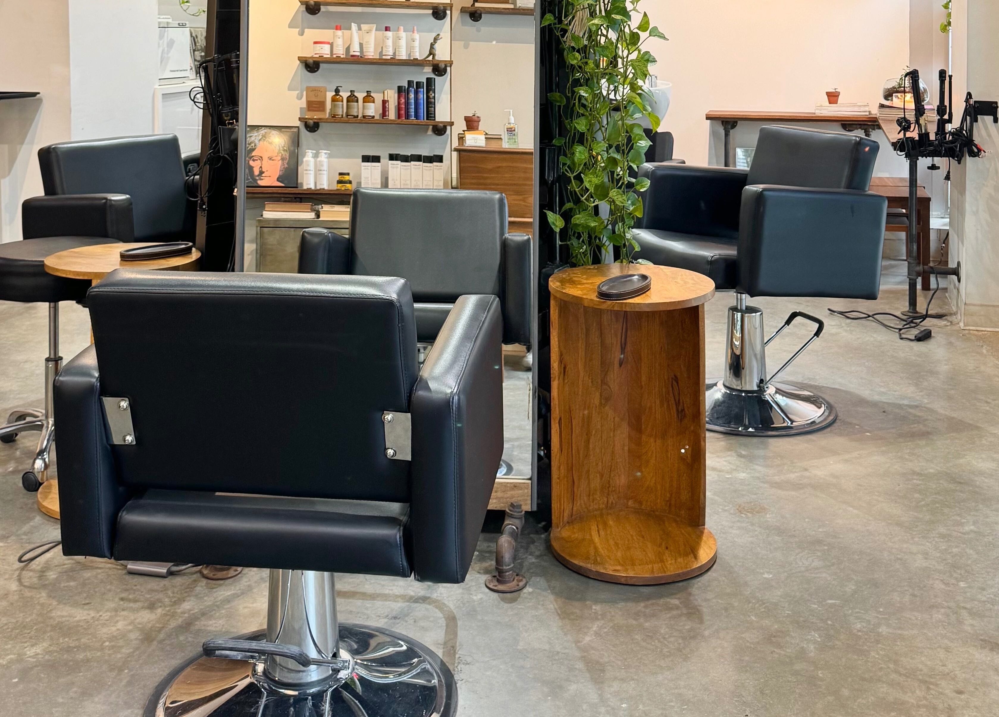 Elegant salon chairs and products at Laurel Bowery, New York, New York, US, offering beauty and wellness services.