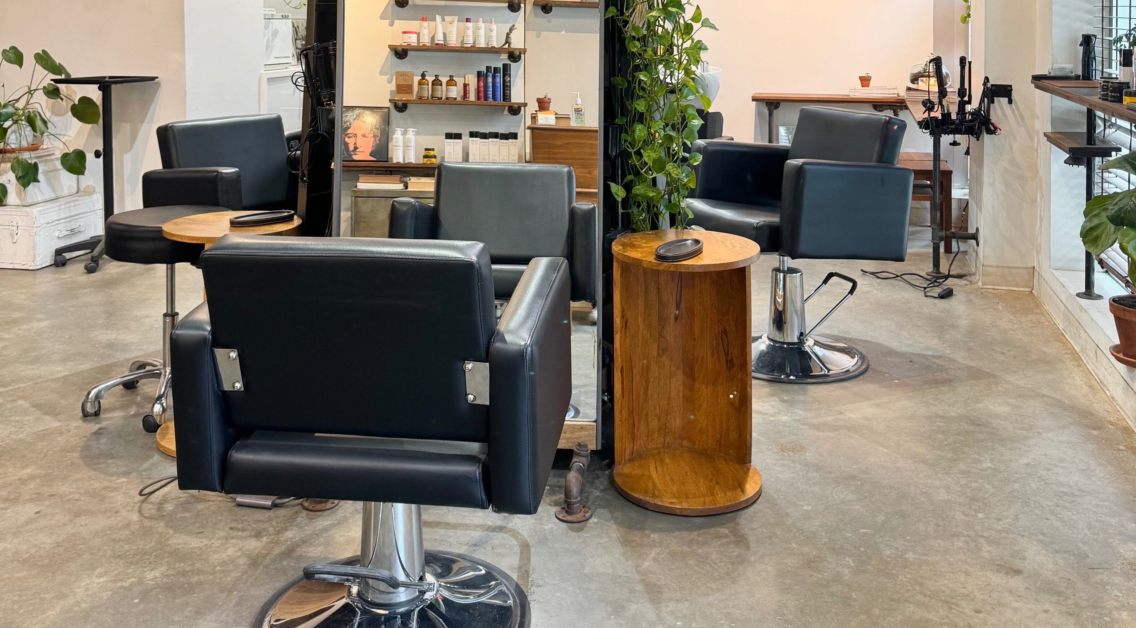 Elegant salon chairs and products at Laurel Bowery, New York, New York, US, offering beauty and wellness services.