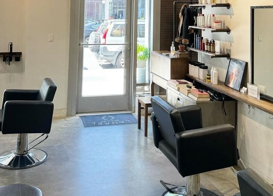Elegant salon interior at Laurel Bowery, New York, New York, US with stylish chairs and mirror setup.