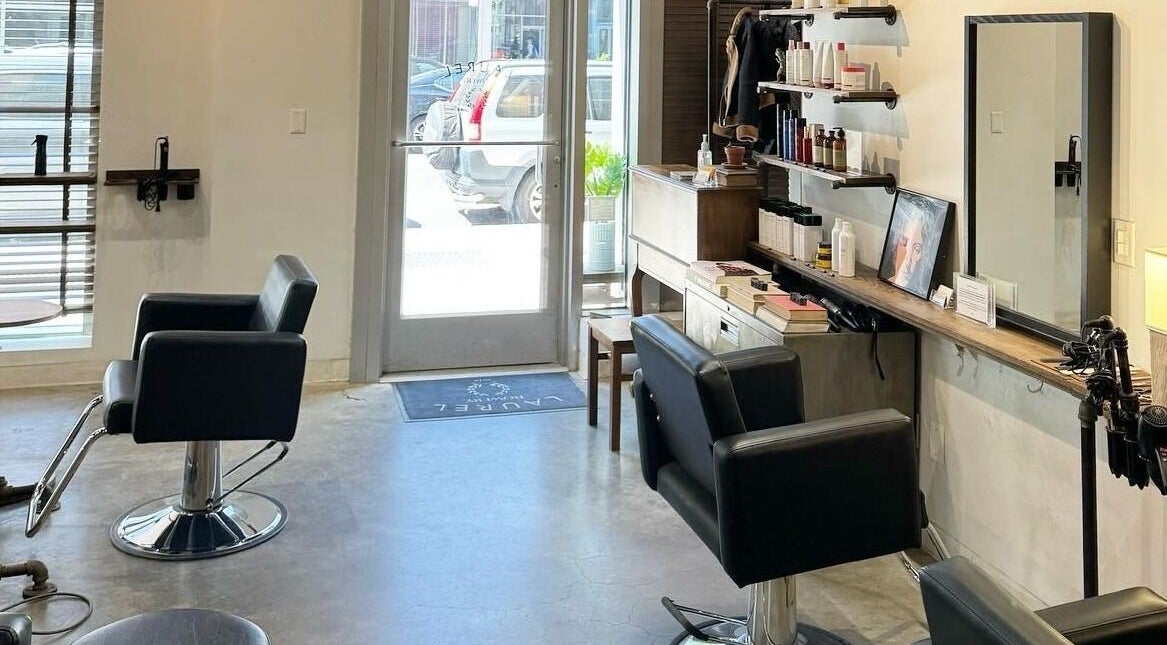 Elegant salon interior at Laurel Bowery, New York, New York, US with stylish chairs and mirror setup.