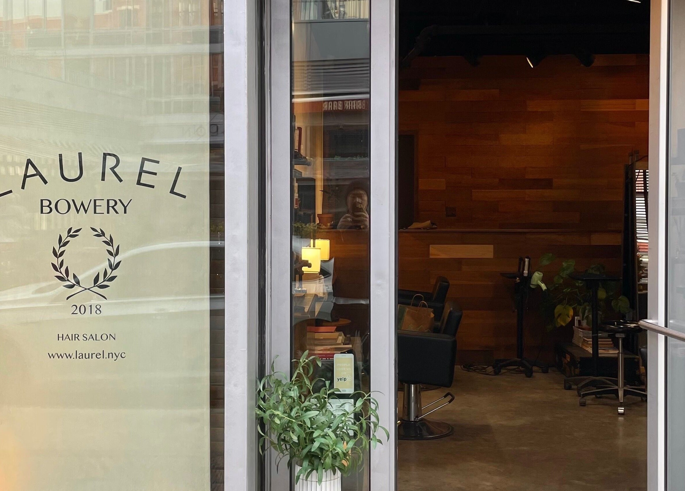 Entrance of Laurel Bowery salon in New York, New York, US, showcasing stylish interior design.