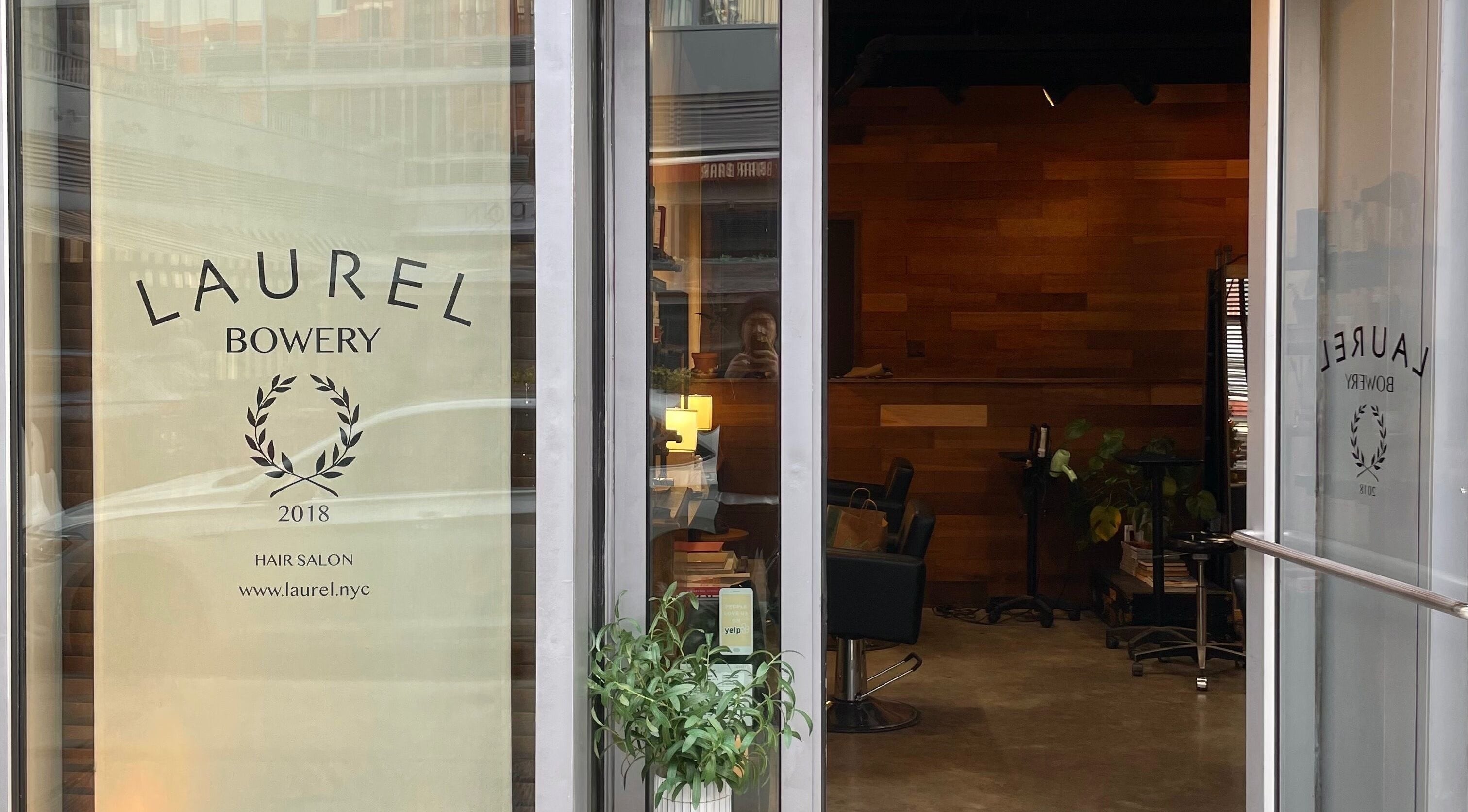 Entrance of Laurel Bowery salon in New York, New York, US, showcasing stylish interior design.