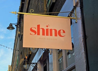 Sign for Hairbyntash @ Shine Hair in Dundee, Scotland, GB, showcasing elegant design.