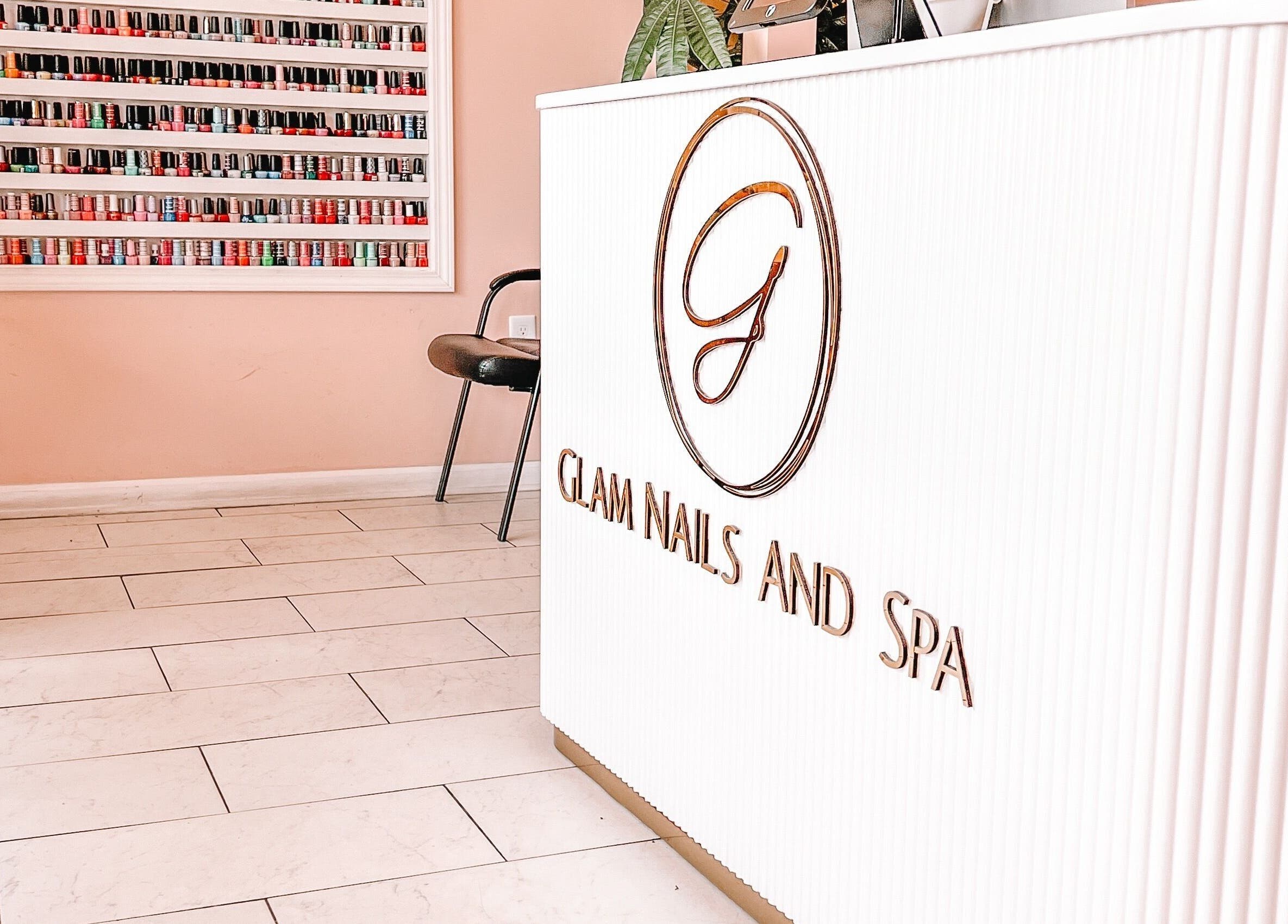 Reception area of Glam Nails And Spa in Bowling Green, Kentucky, US with nail polish display.