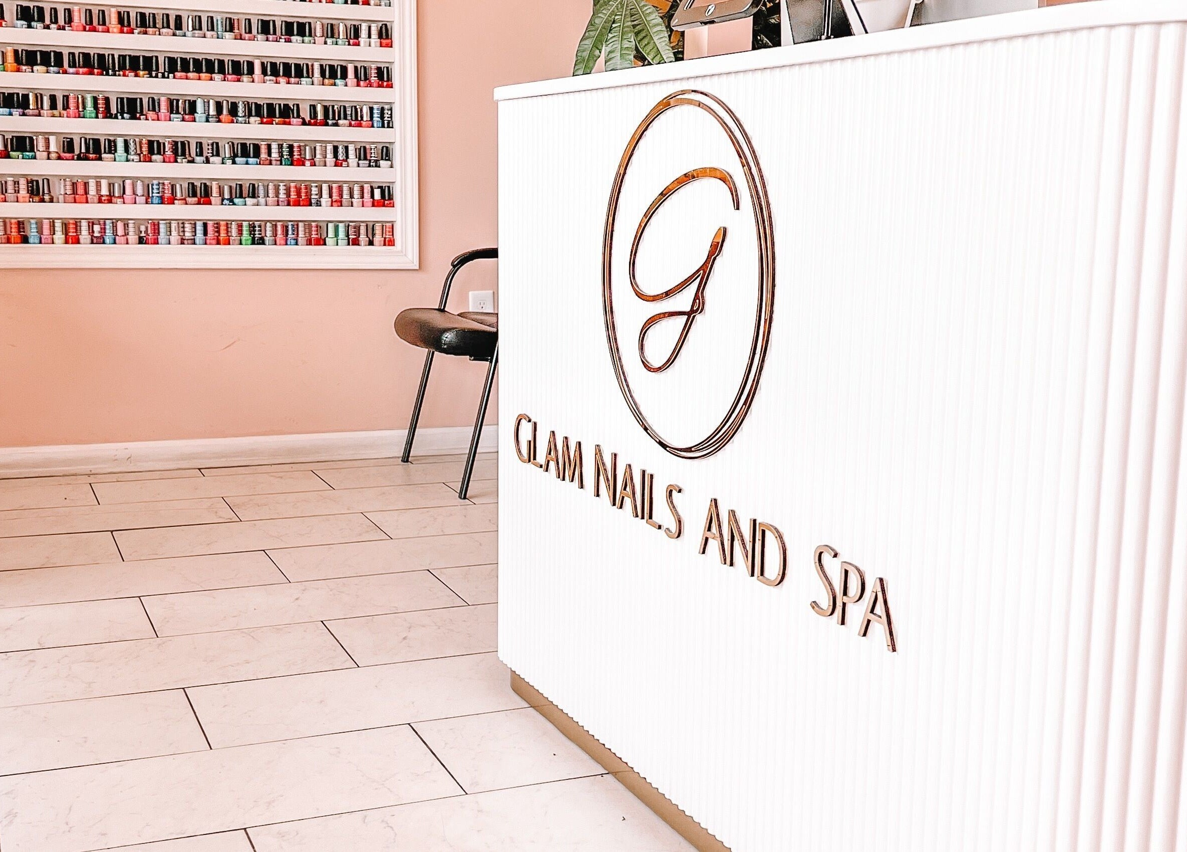 Reception area of Glam Nails And Spa in Bowling Green, Kentucky, US with nail polish display.