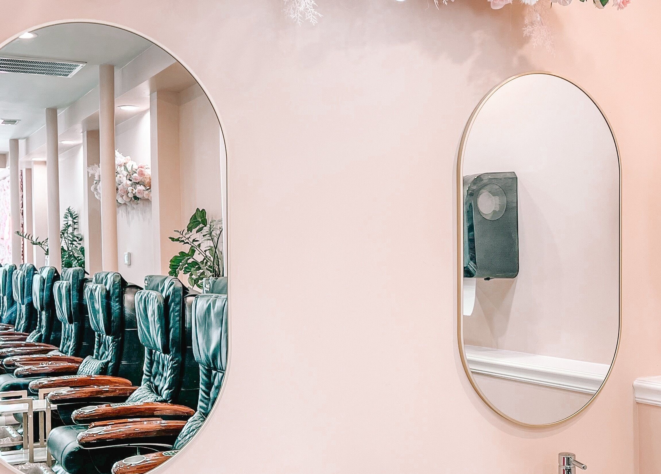Elegant nail salon interior at Glam Nails And Spa, Bowling Green, Kentucky, US, with stylish seating and mirrors.