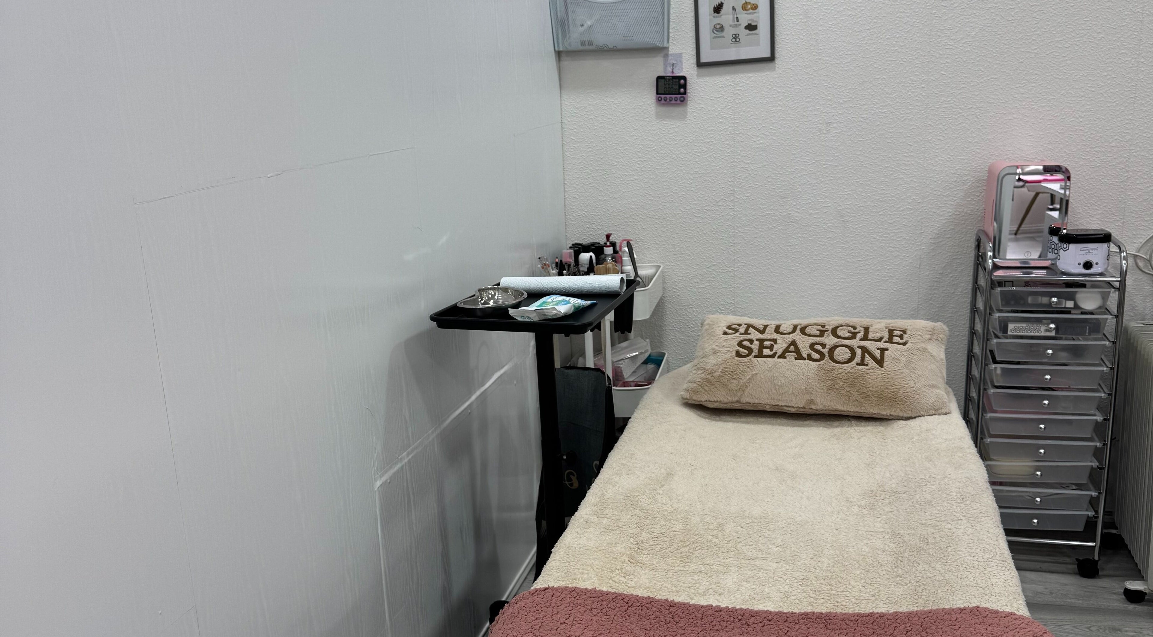 Comfortable treatment bed at Matylashes and Beauty, London, England, GB, ready for a relaxing session.