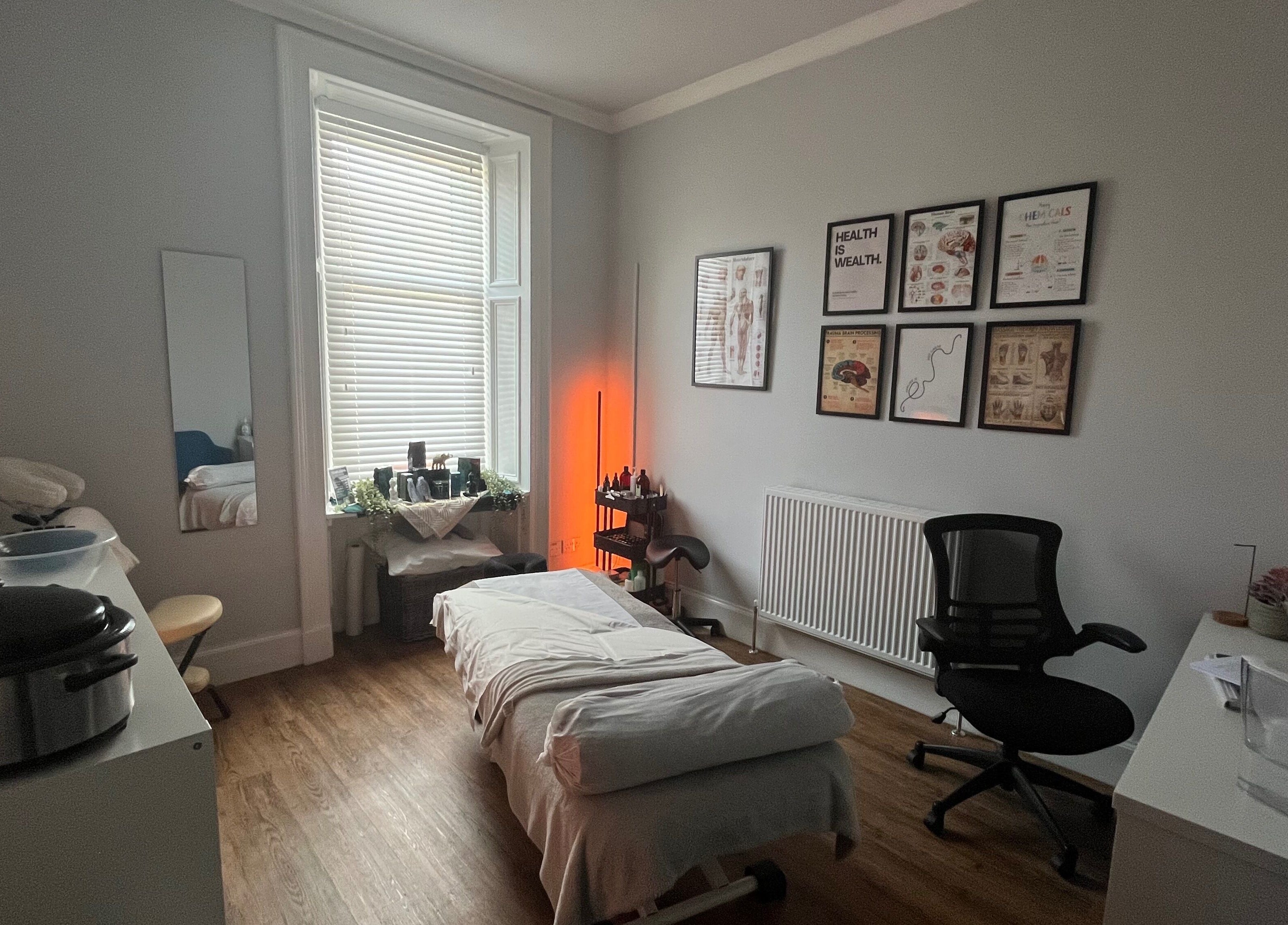 Calming therapy room at Holistic Healthcare Ayrshire in Ayr, Scotland, GB with massage table and wellness decor.