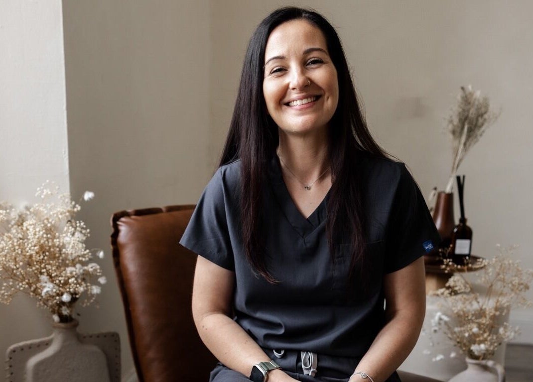 Smiling woman at Holistic Healthcare Ayrshire, Ayr, Scotland, GB, enhancing the serene wellness ambiance.