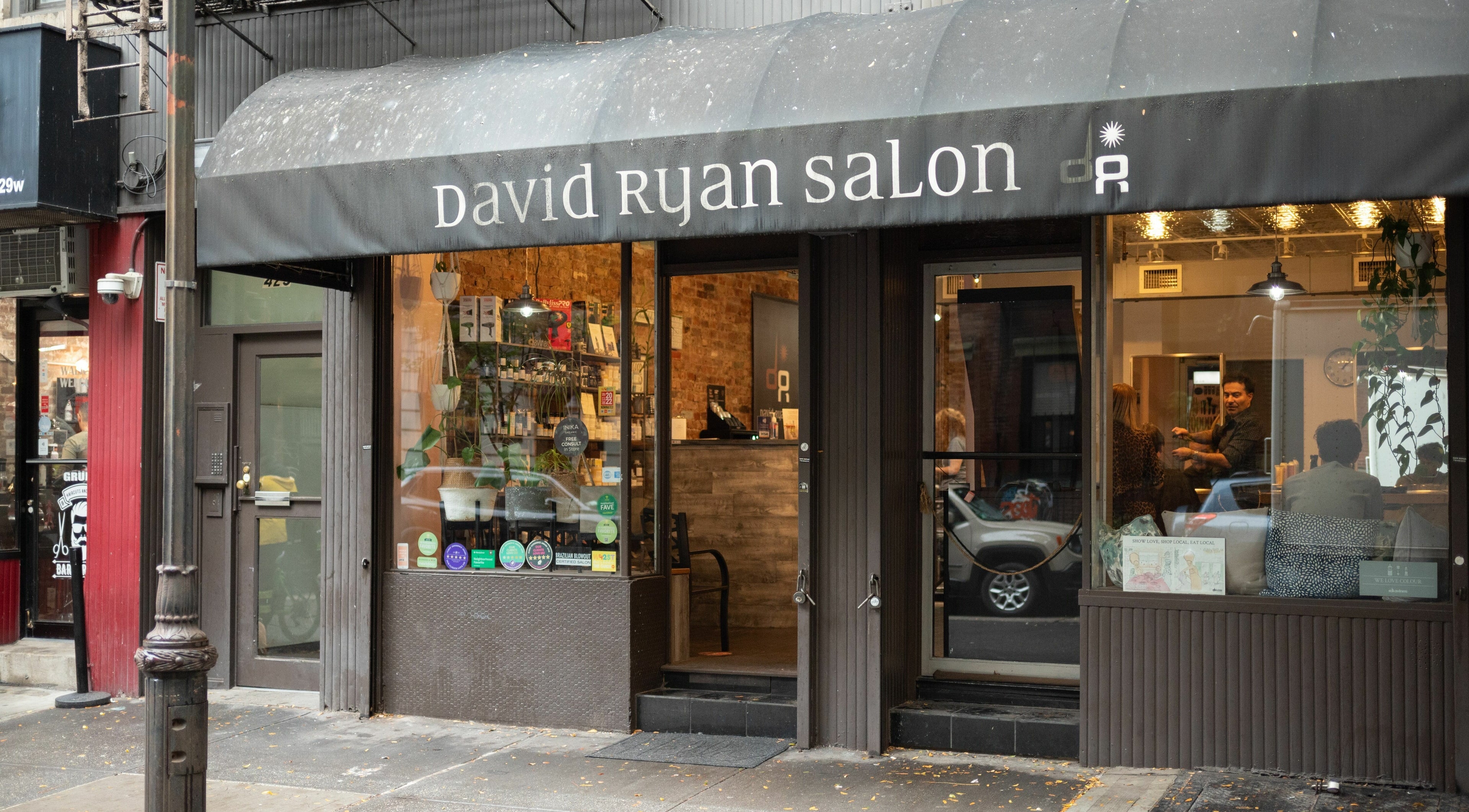 David Ryan Salon's inviting entrance located in New York, New York, US, featuring a stylish black awning.