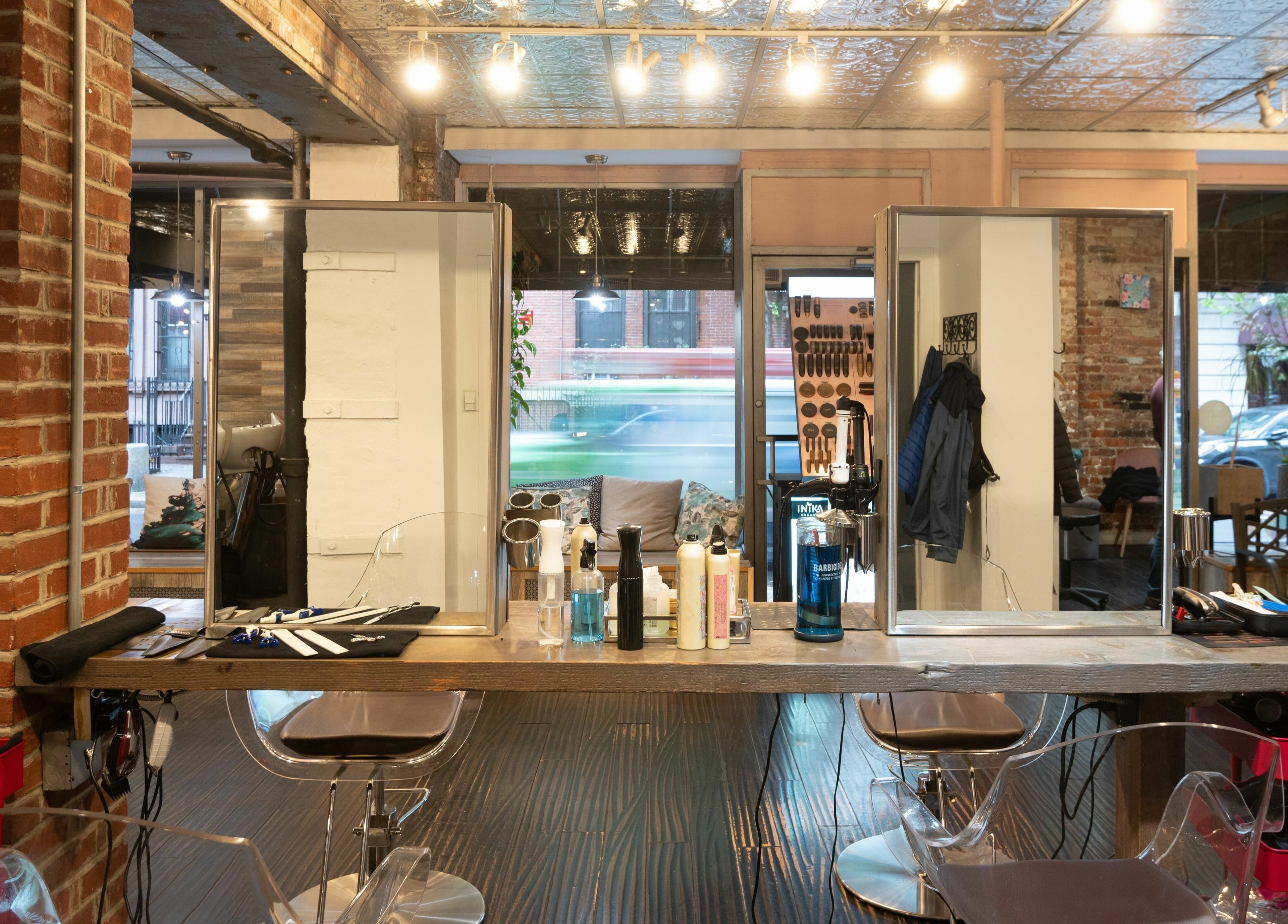 Elegant styling stations at David Ryan Salon, New York, New York, US showcasing modern design and tools.