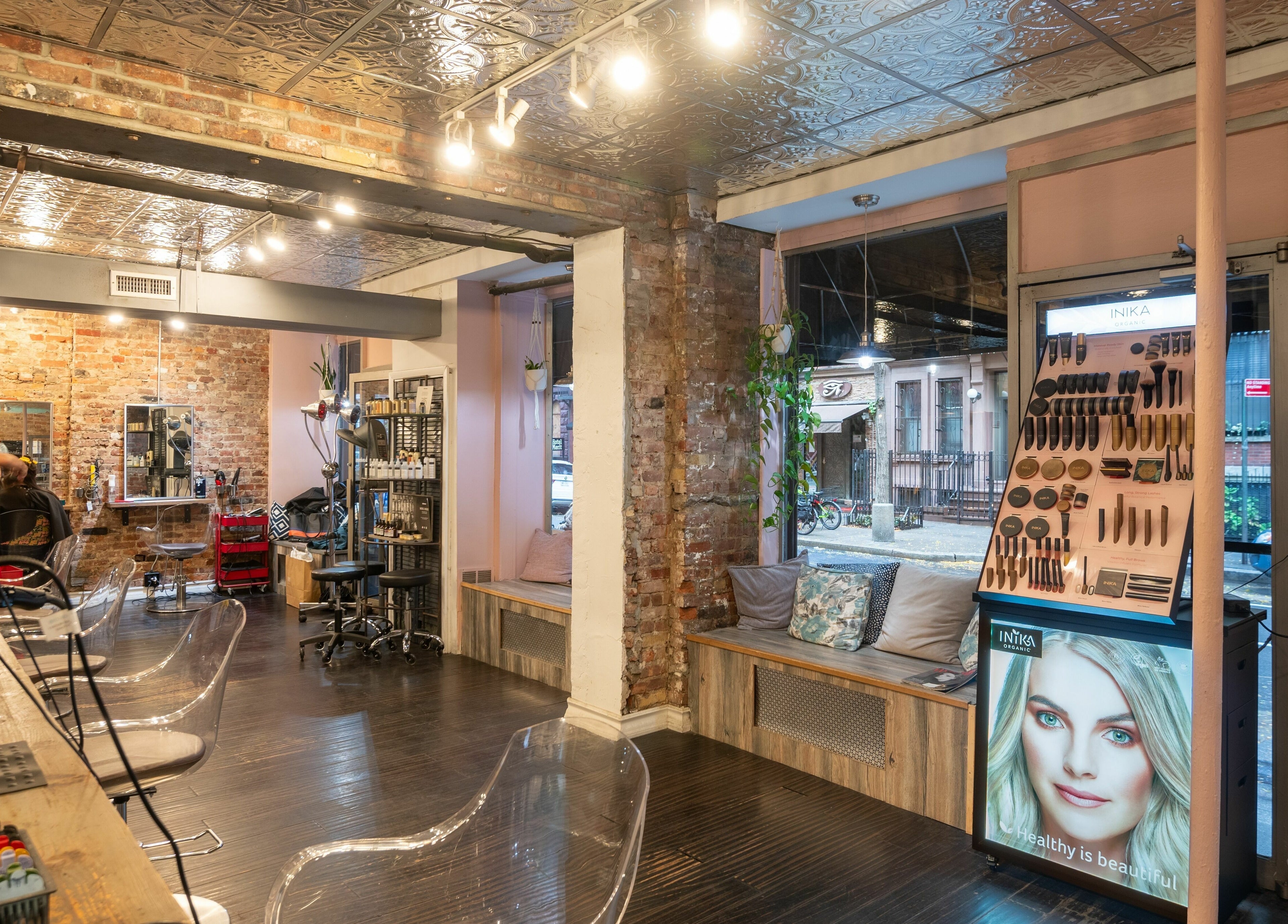 Modern interior of David Ryan Salon, New York, New York, US, with stylish seating and beauty products.
