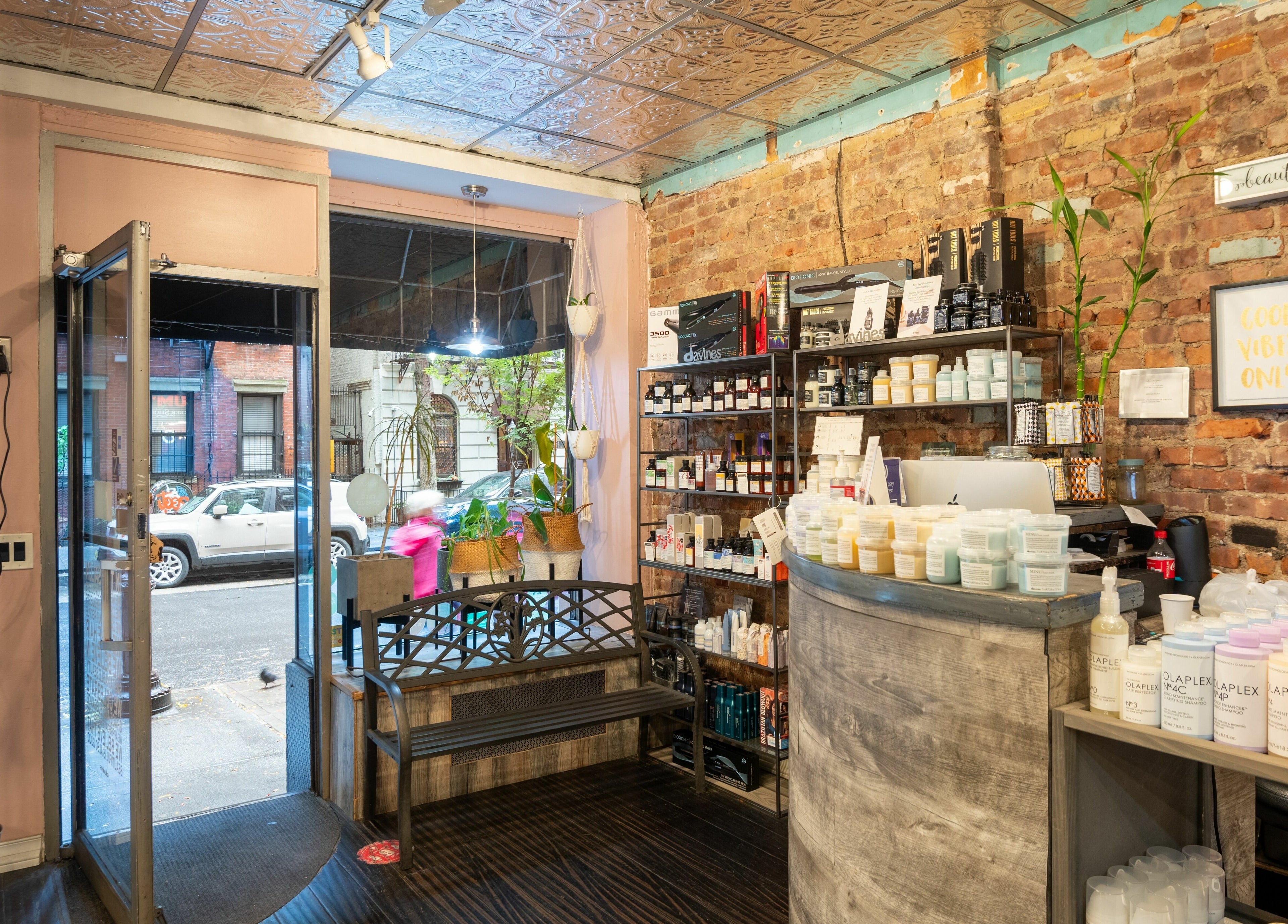 Cozy interior of David Ryan Salon in New York, New York, US, showcasing product display and welcoming decor.