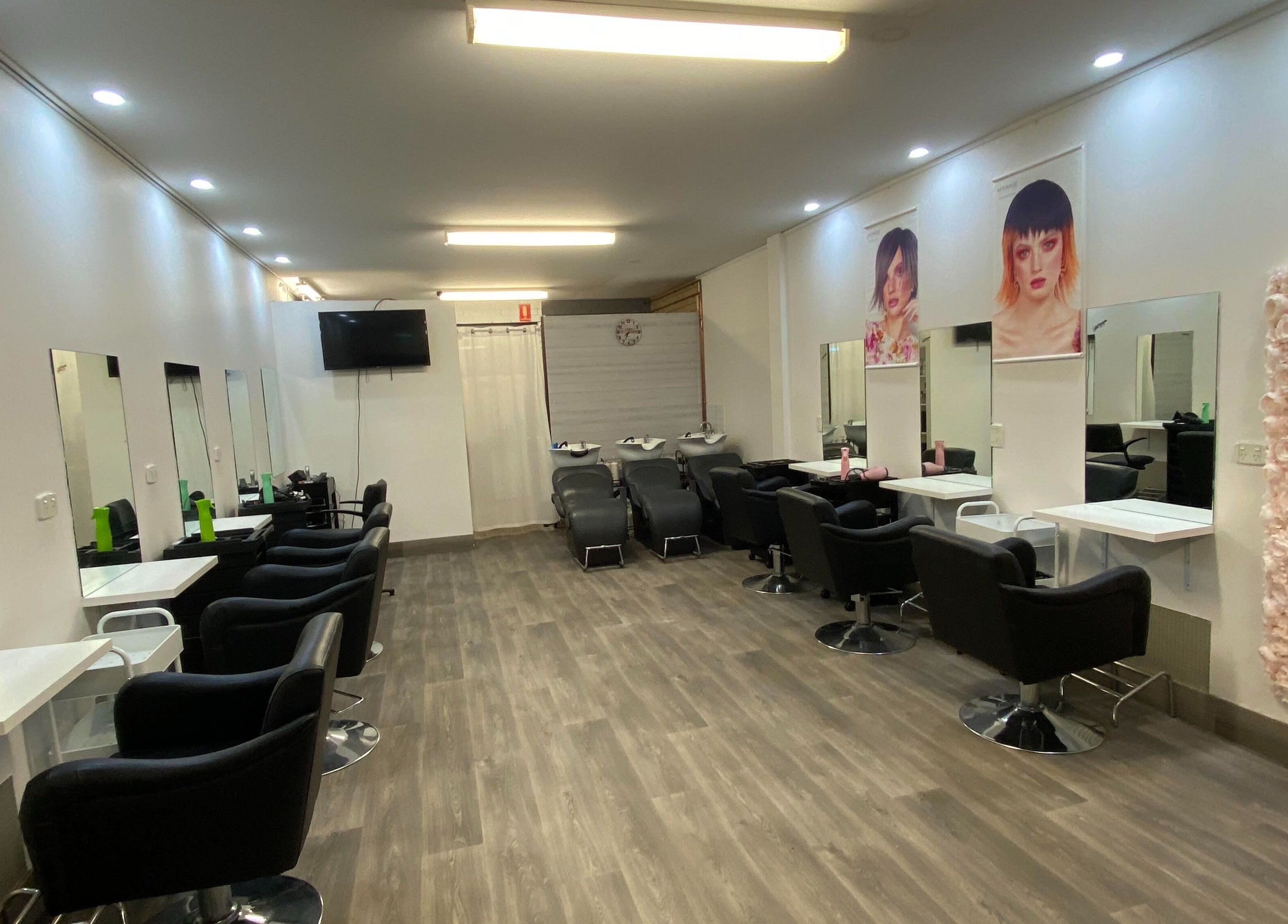 Modern salon interior at Hairworkz Eagleby, featuring chic styling stations in Eagleby, Queensland, AU.