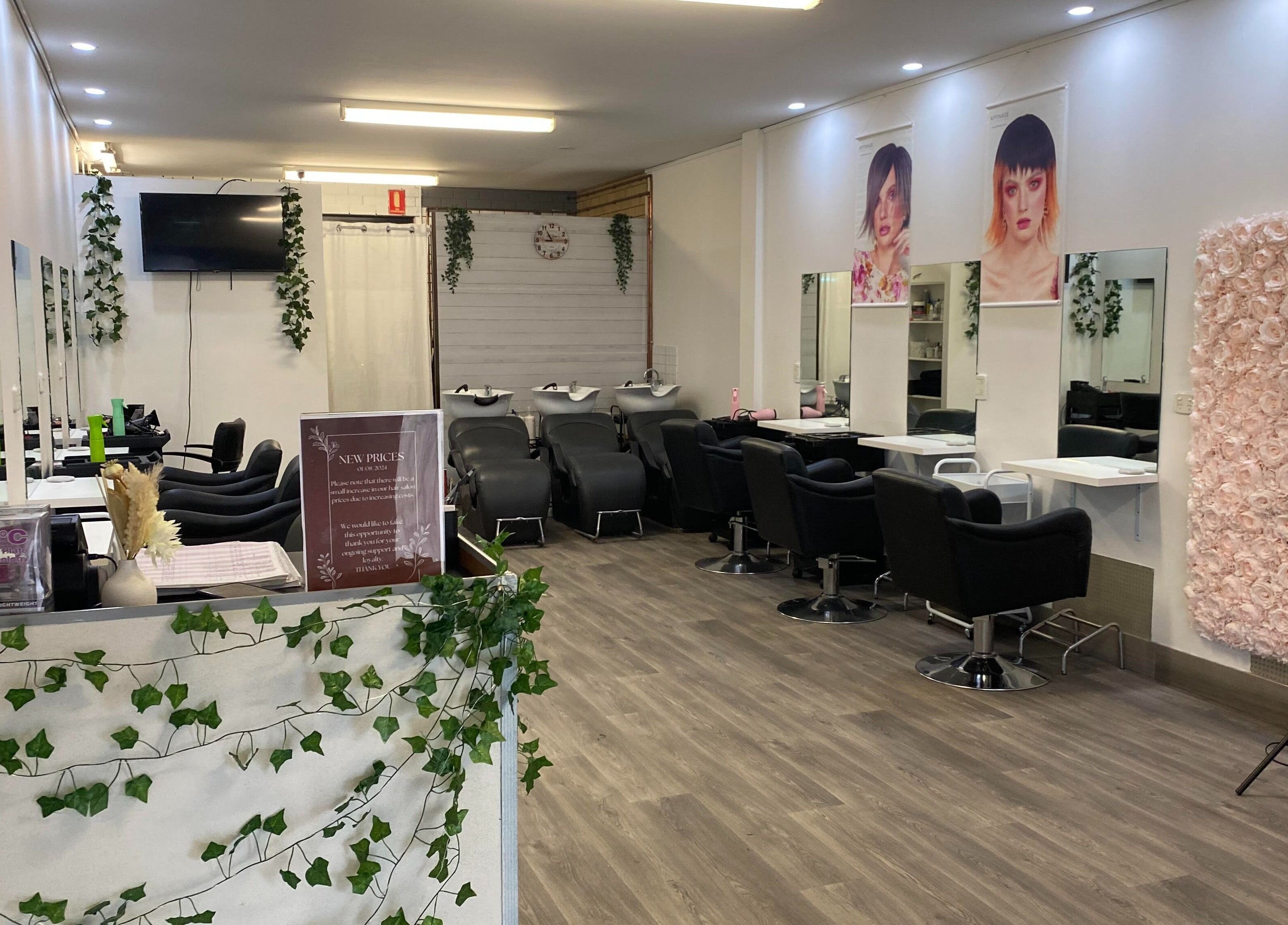 Stylish Hairworkz Eagleby salon in Eagleby, Queensland, AU showcasing modern chairs and decor.