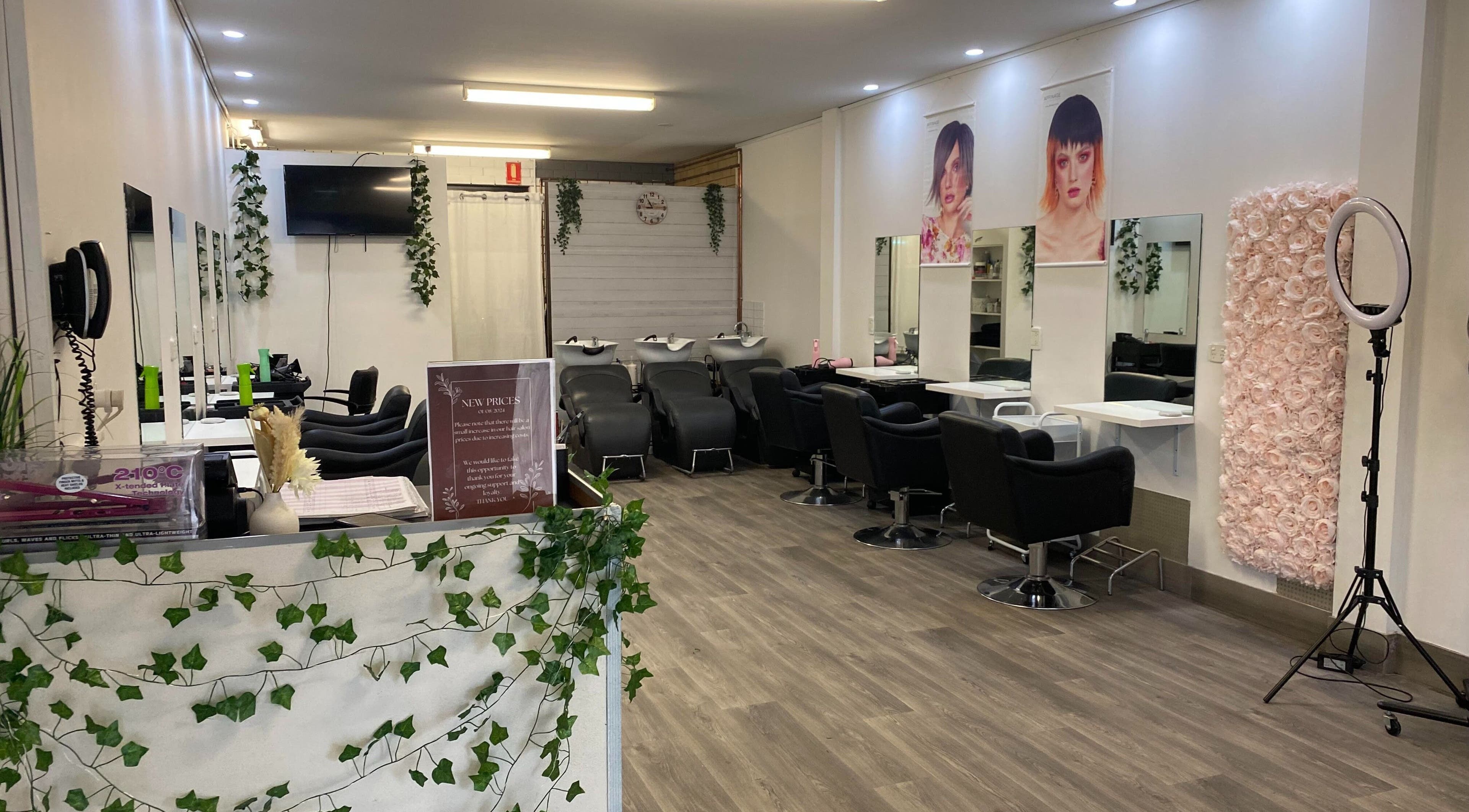 Stylish Hairworkz Eagleby salon in Eagleby, Queensland, AU showcasing modern chairs and decor.