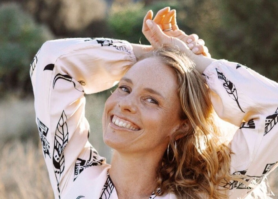 Smiling woman enjoying nature at State Of Ananda - Home Massage Studio, Torquay, Victoria, AU.