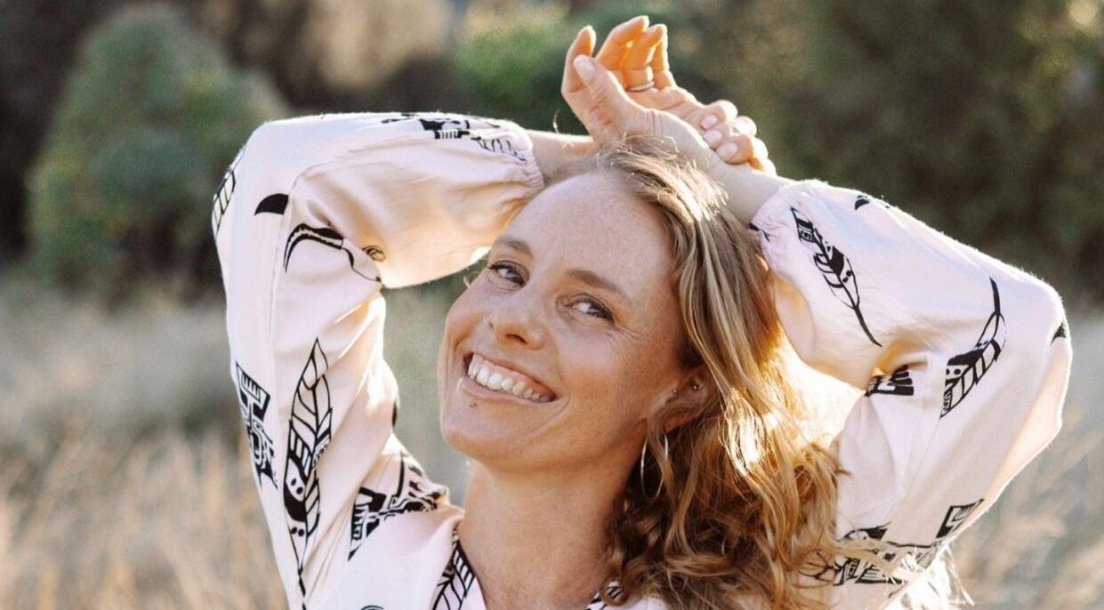 Smiling woman enjoying nature at State Of Ananda - Home Massage Studio, Torquay, Victoria, AU.