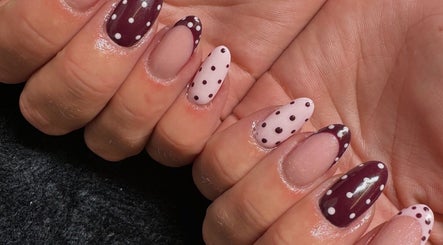 Stylish polka dot nails at EM BEAUTY, Egremont, England, GB, showcasing chic design.