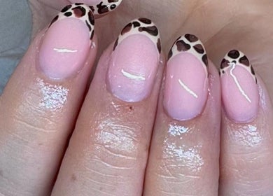 Leopard print nail art at EM BEAUTY in Egremont, England, GB. Elegant pink manicure with unique patterns.