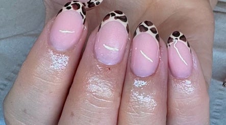 Leopard print nail art at EM BEAUTY in Egremont, England, GB. Elegant pink manicure with unique patterns.