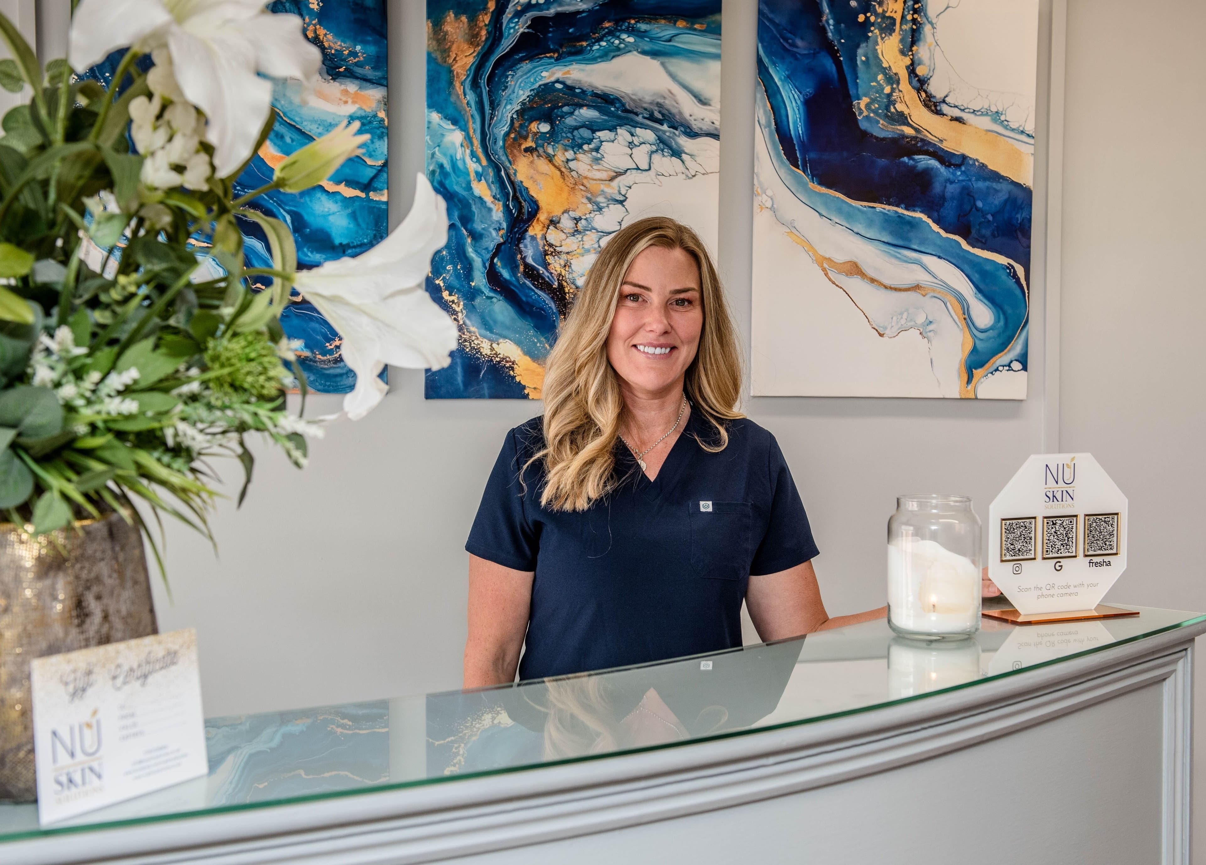 Warm welcome at NuSkin Solutions reception, Richmond, England, GB, with elegant floral decor.