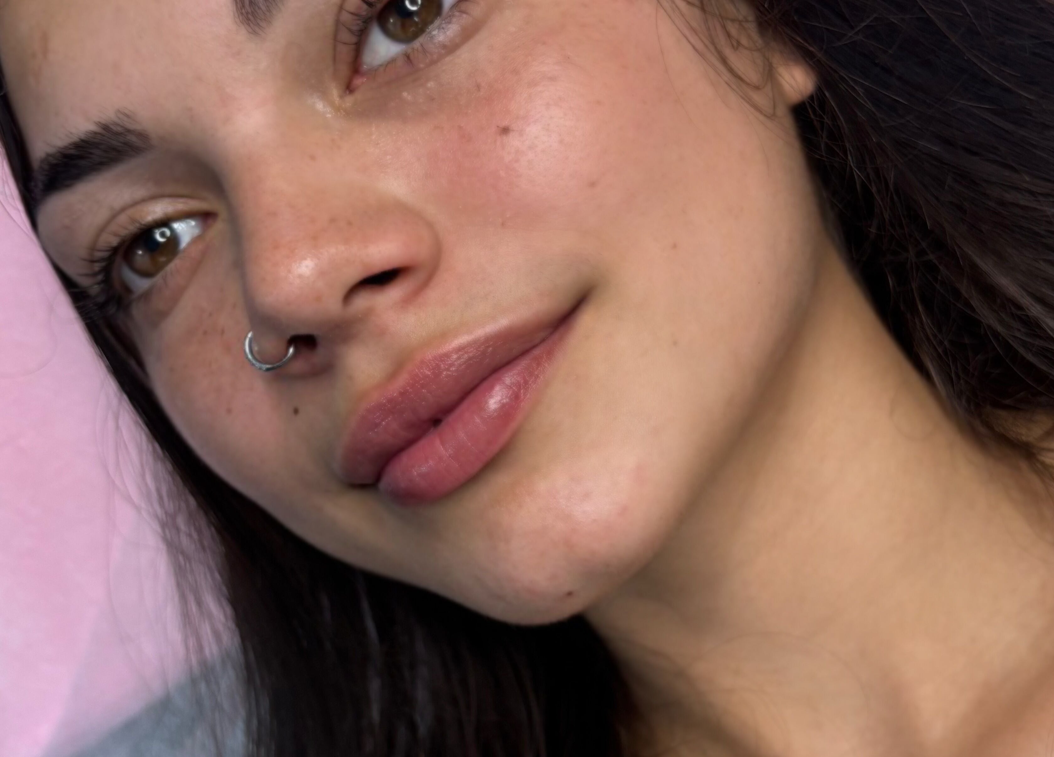 Close-up of smiling woman with flawless eyebrows at Zahli Brows, Palmview, Queensland, AU.