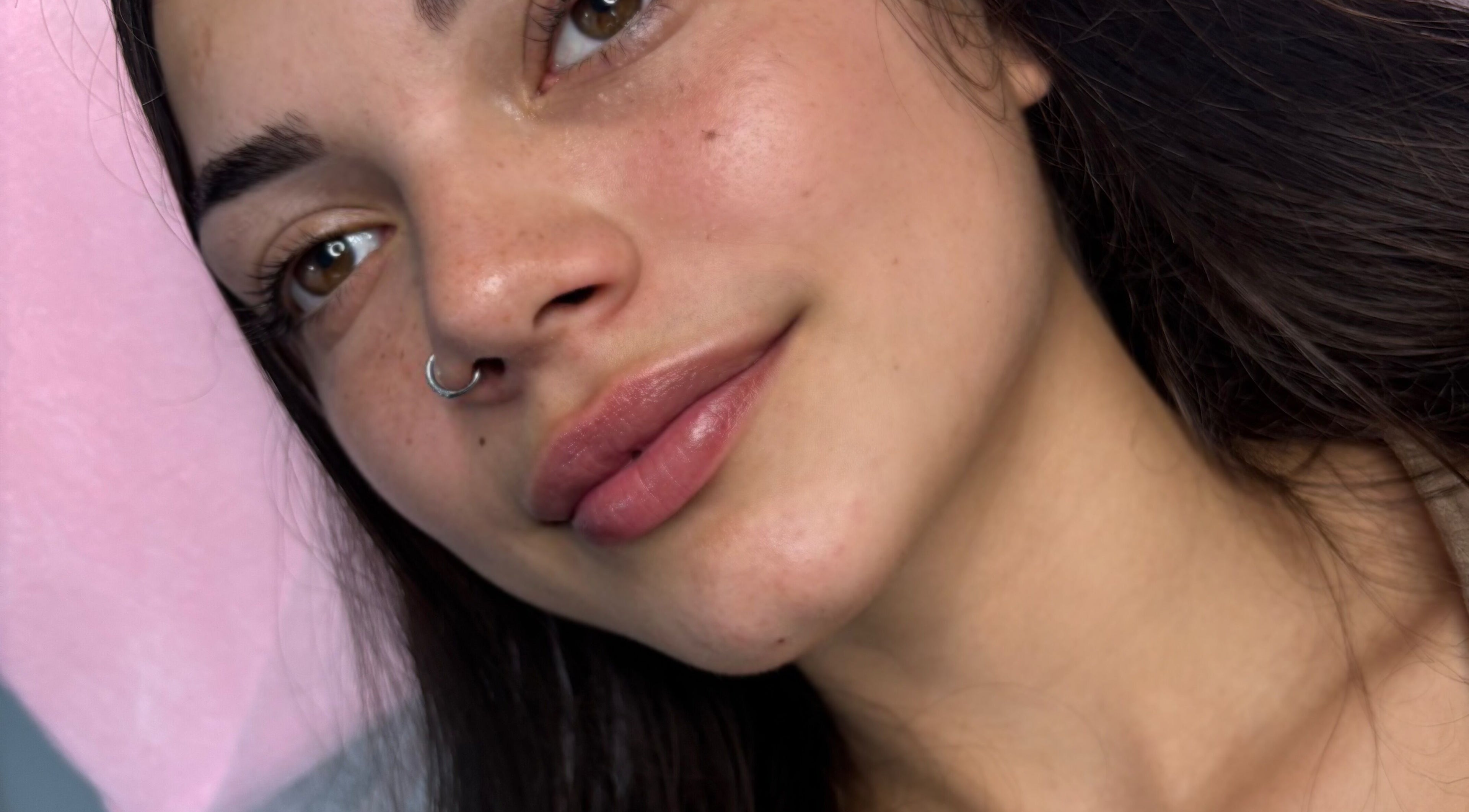 Close-up of smiling woman with flawless eyebrows at Zahli Brows, Palmview, Queensland, AU.